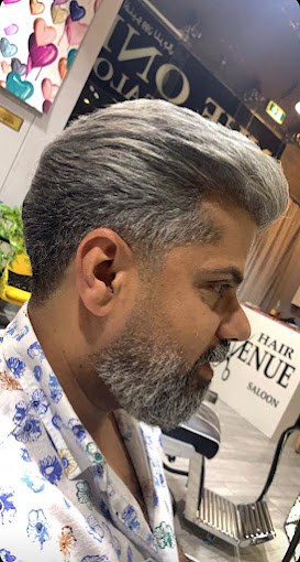 Finished short grey haircut photographed inside Avenue One