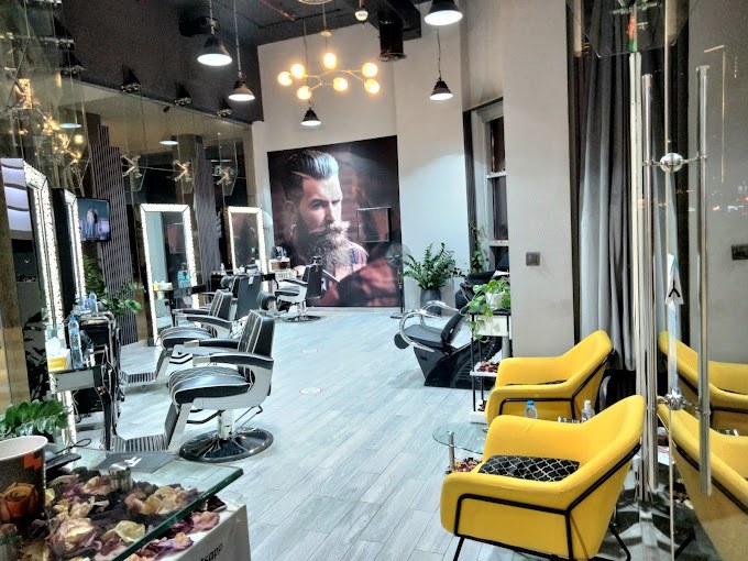 Avenue One grooming stations and yellow lounge chairs